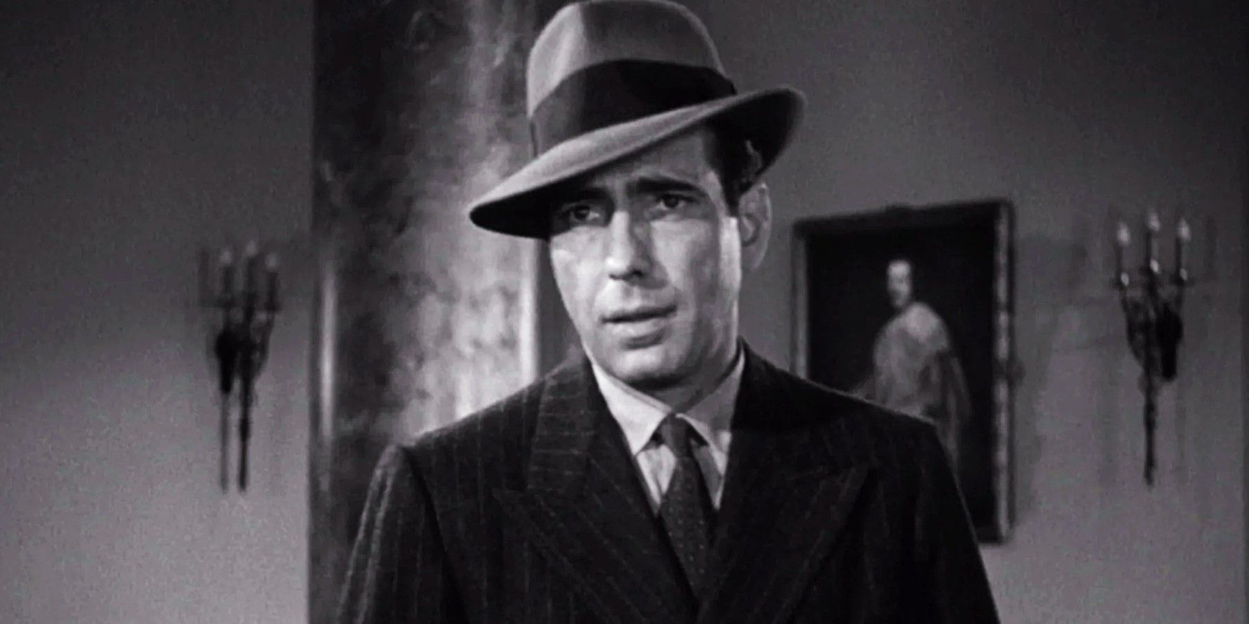 Humphrey Bogart as Sam Spade looks suspicious in “The Maltese Falcon”