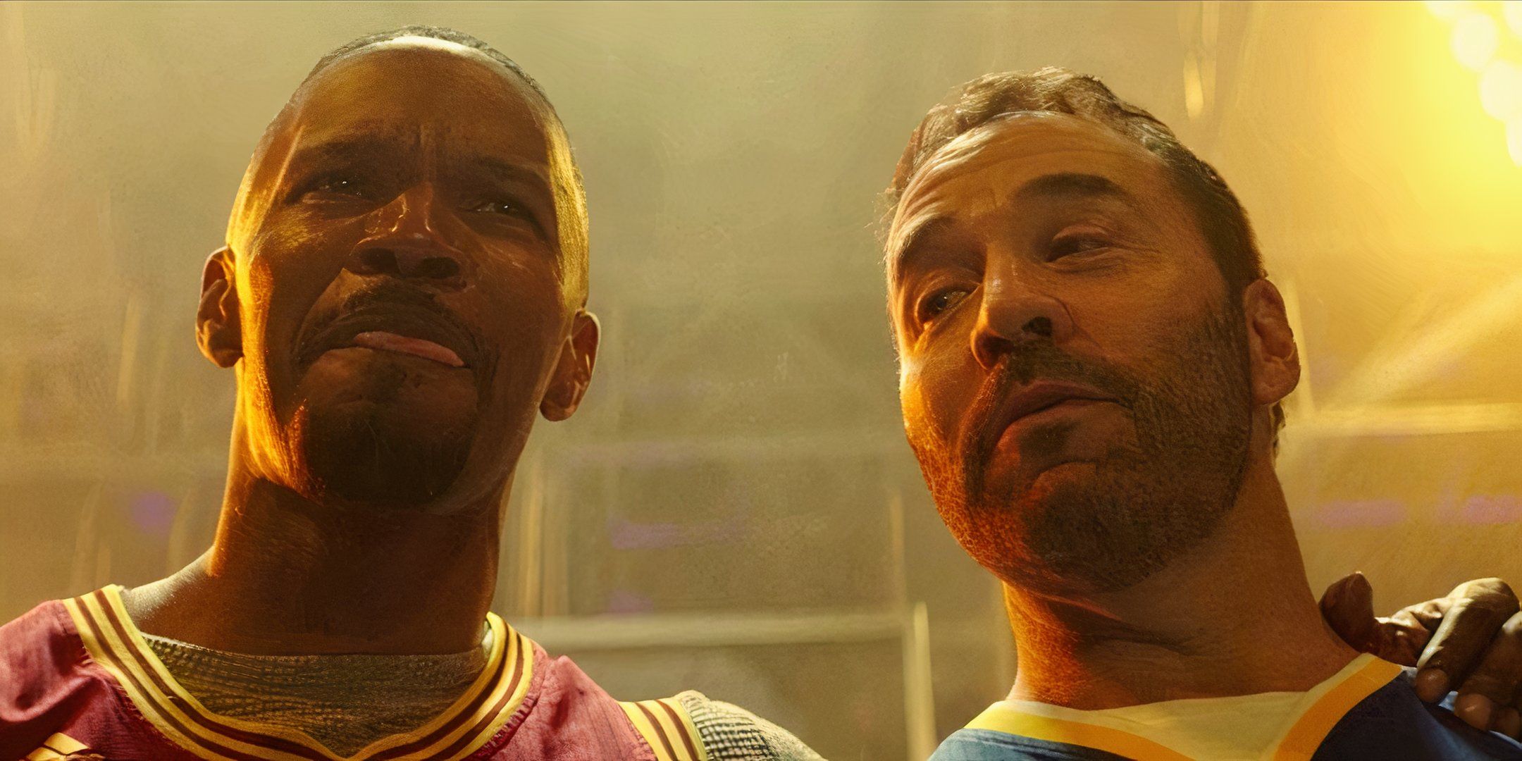 Jamie Foxx and Jeremy Piven are dressed in basketball jerseys. 