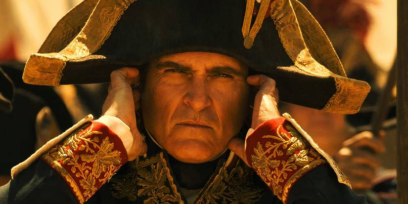 Joaquin Phoenix as Napoleon covering his ears in Napoleon