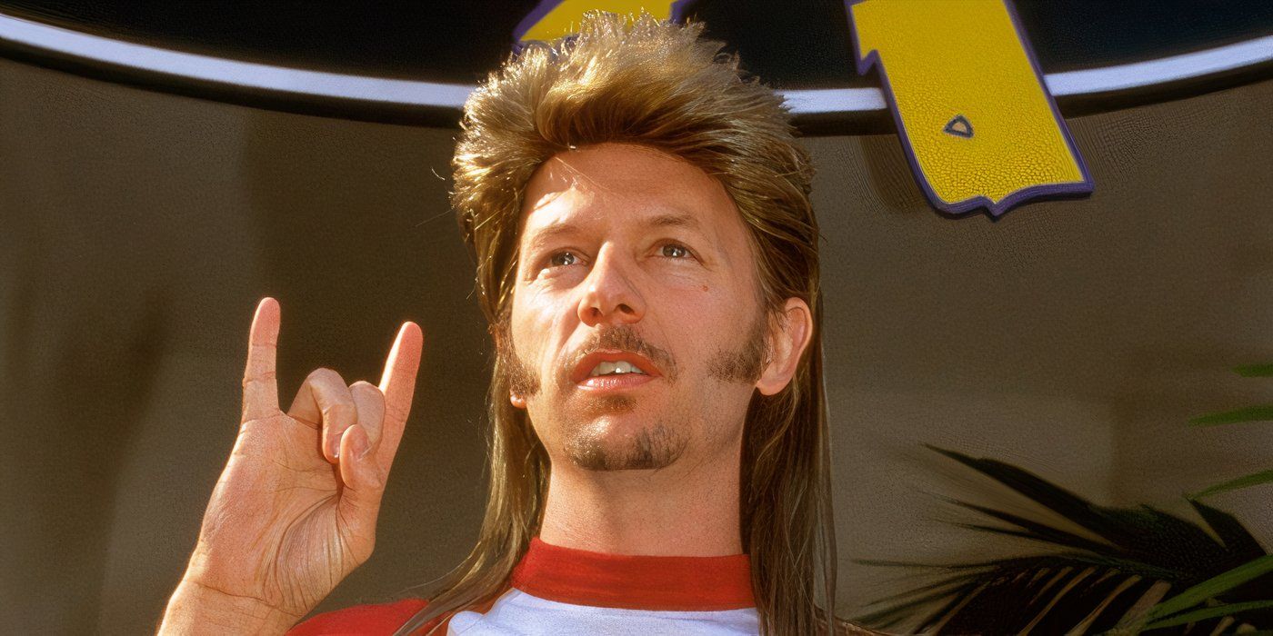 Joe Dirt (David Spade) fazendo um gesto de rock and roll com a mão em Joe Dirt