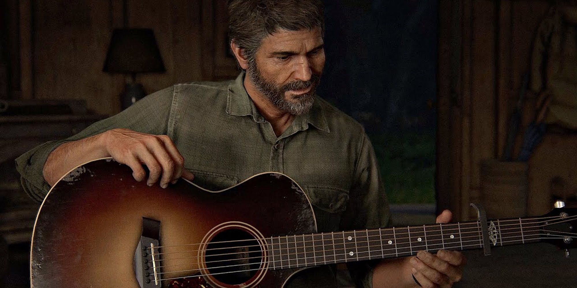 Joel holding a guitar in The Last of Us Part II