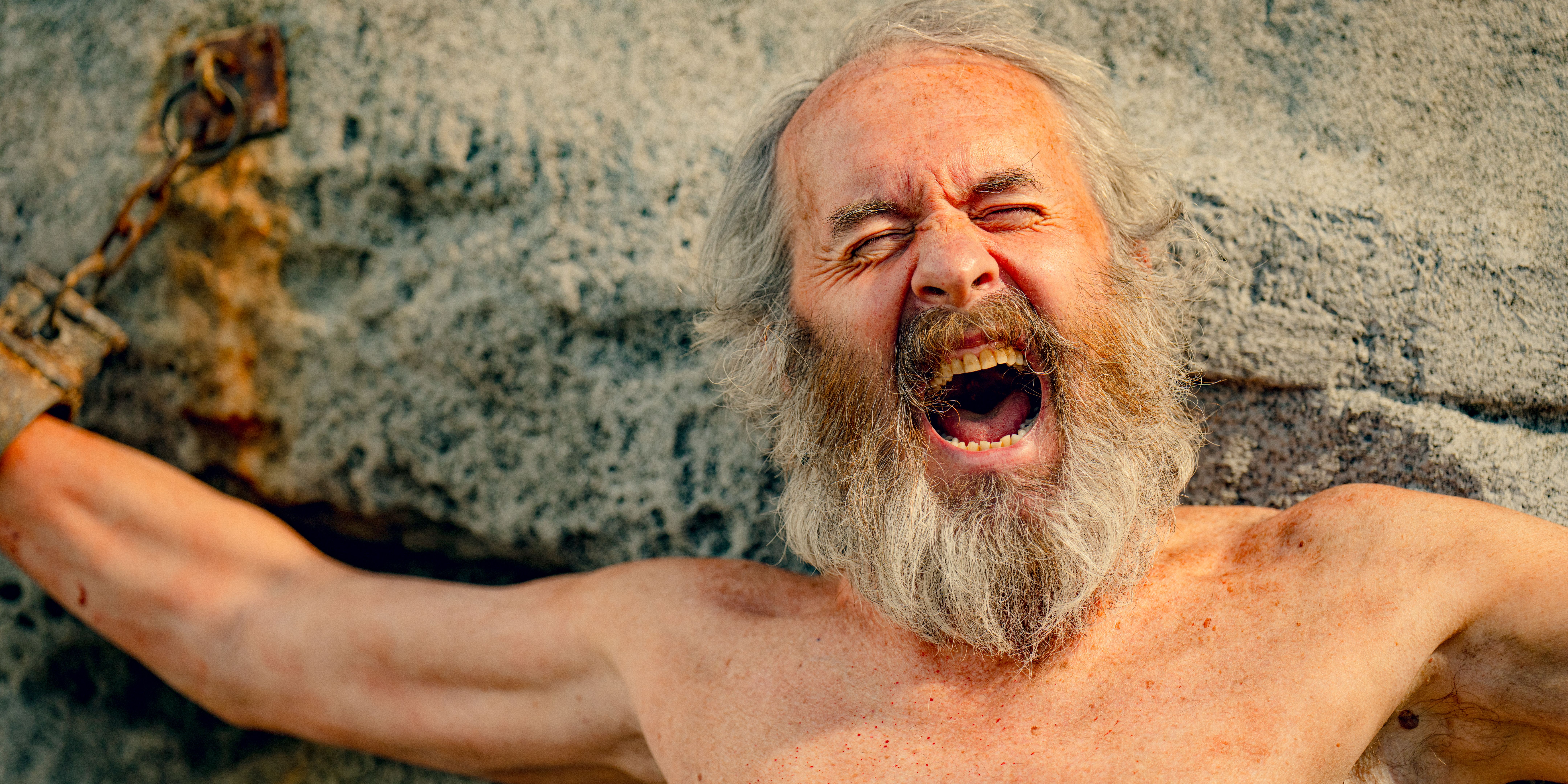 Prometheus (Stephen Dillane) chained to a rock in KAOS Season 1