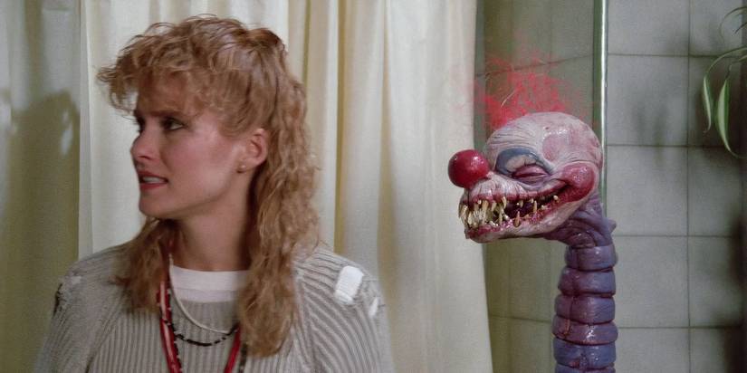 clown puppet and woman in Killer Klowns from Outer Space