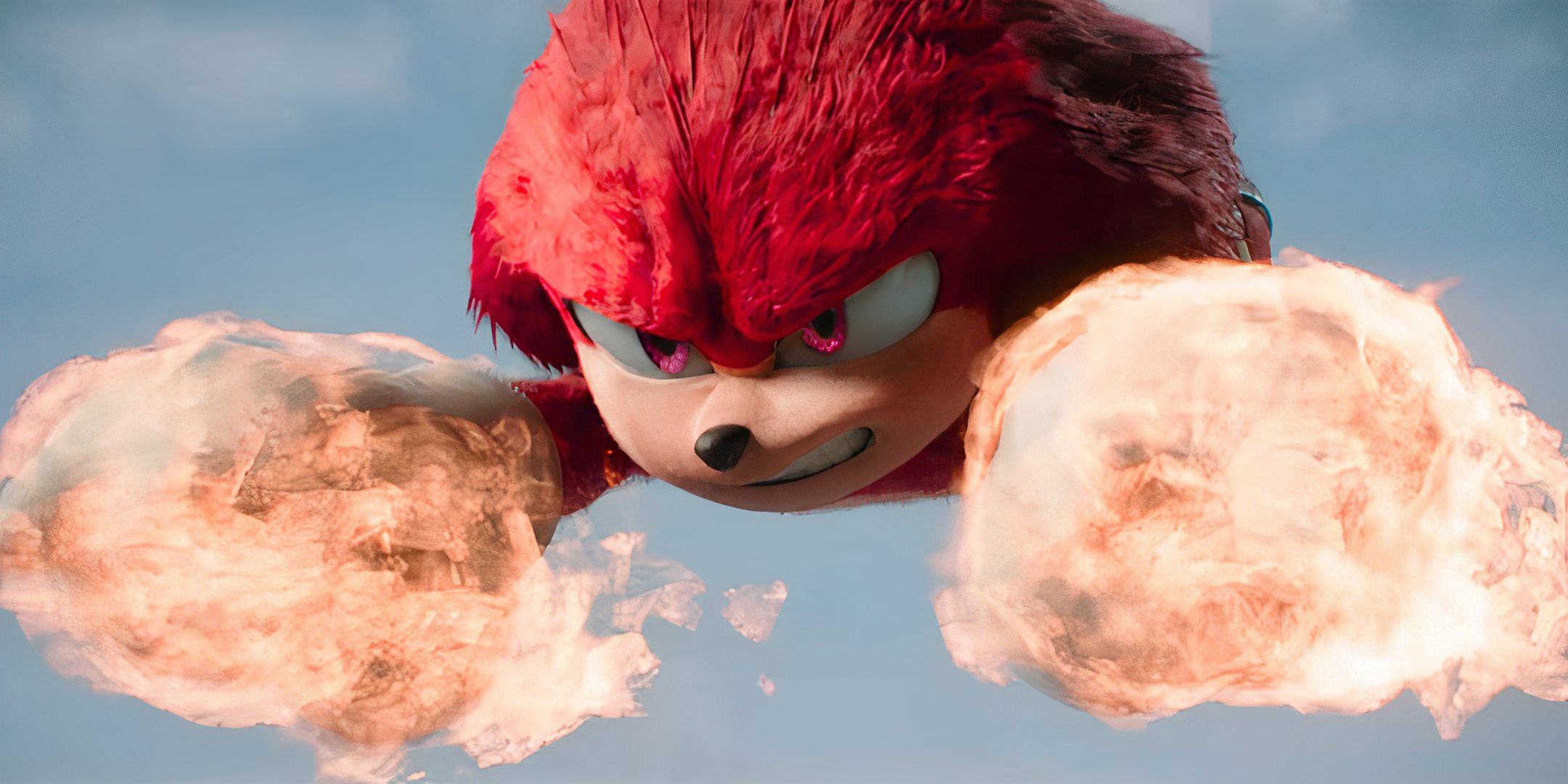 Knuckles flying through the air with fiery fists in Sonic the Hedgehog 3