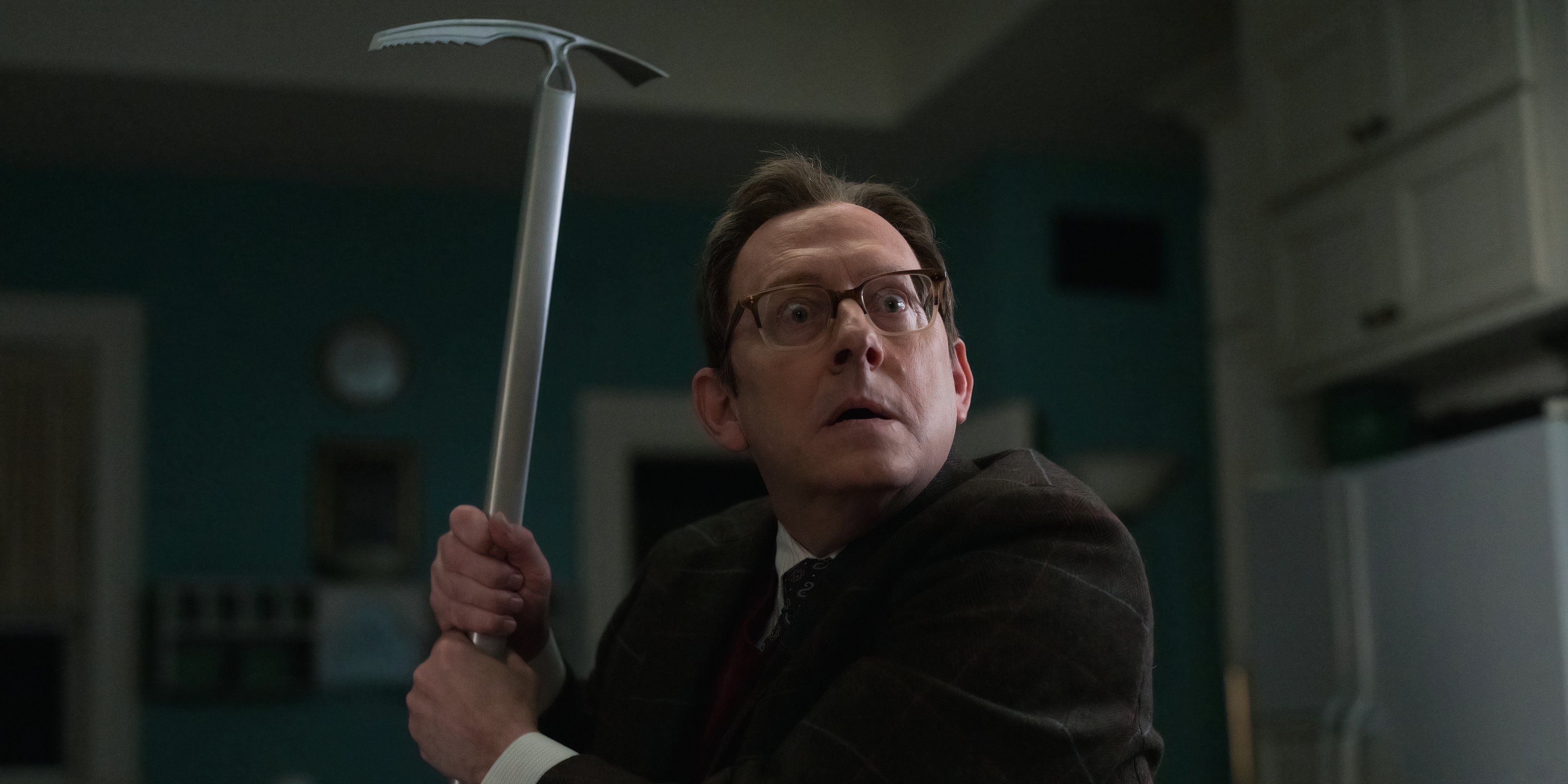 Leland holds a pickaxe in the Evil series finale