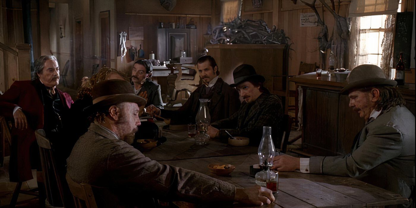 Leon Rippy as Tom Nuttall sitting in a bar in Deadwood