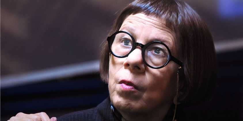 Linda Hunt as Hetty Lang looking at some offscreen with a serious expression in NCIS Los Angeles