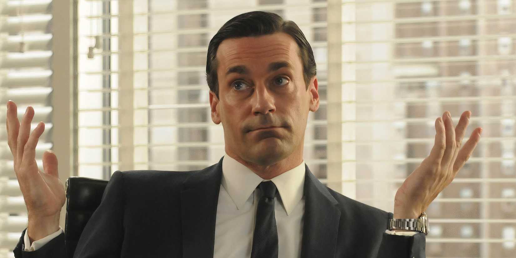 Jon Hamm as Don Draper shrugging in Mad Men