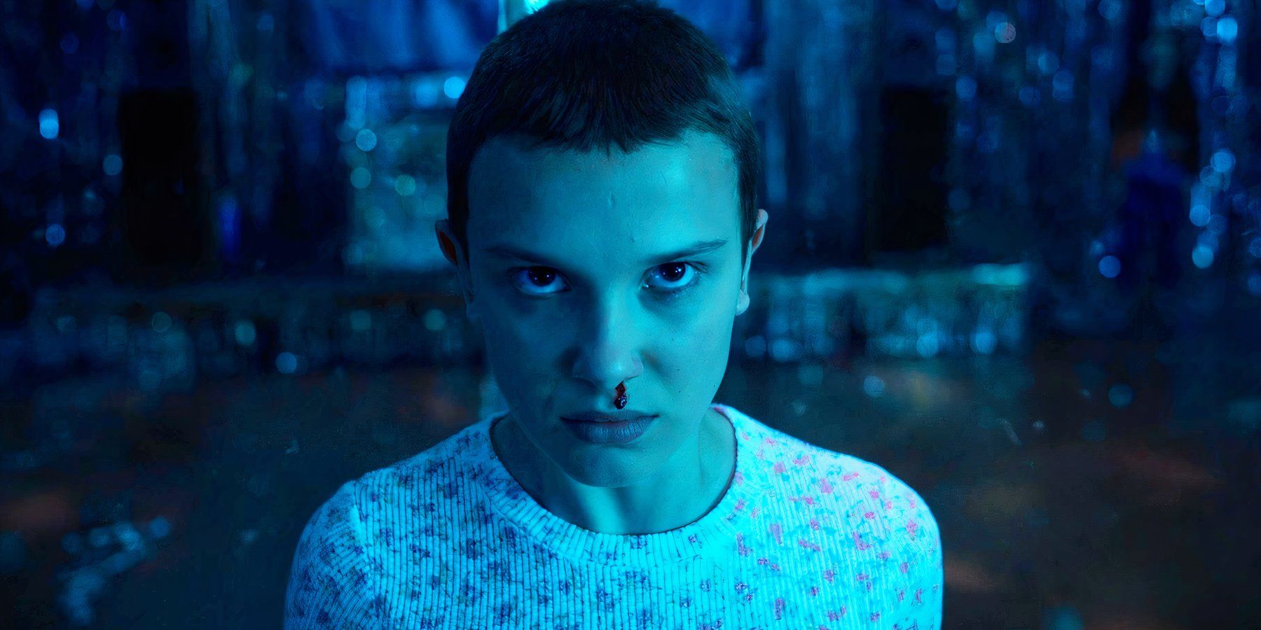 Milly Bobby Brown as Eleven looking determined with a bloody nose in Stranger Things season 4