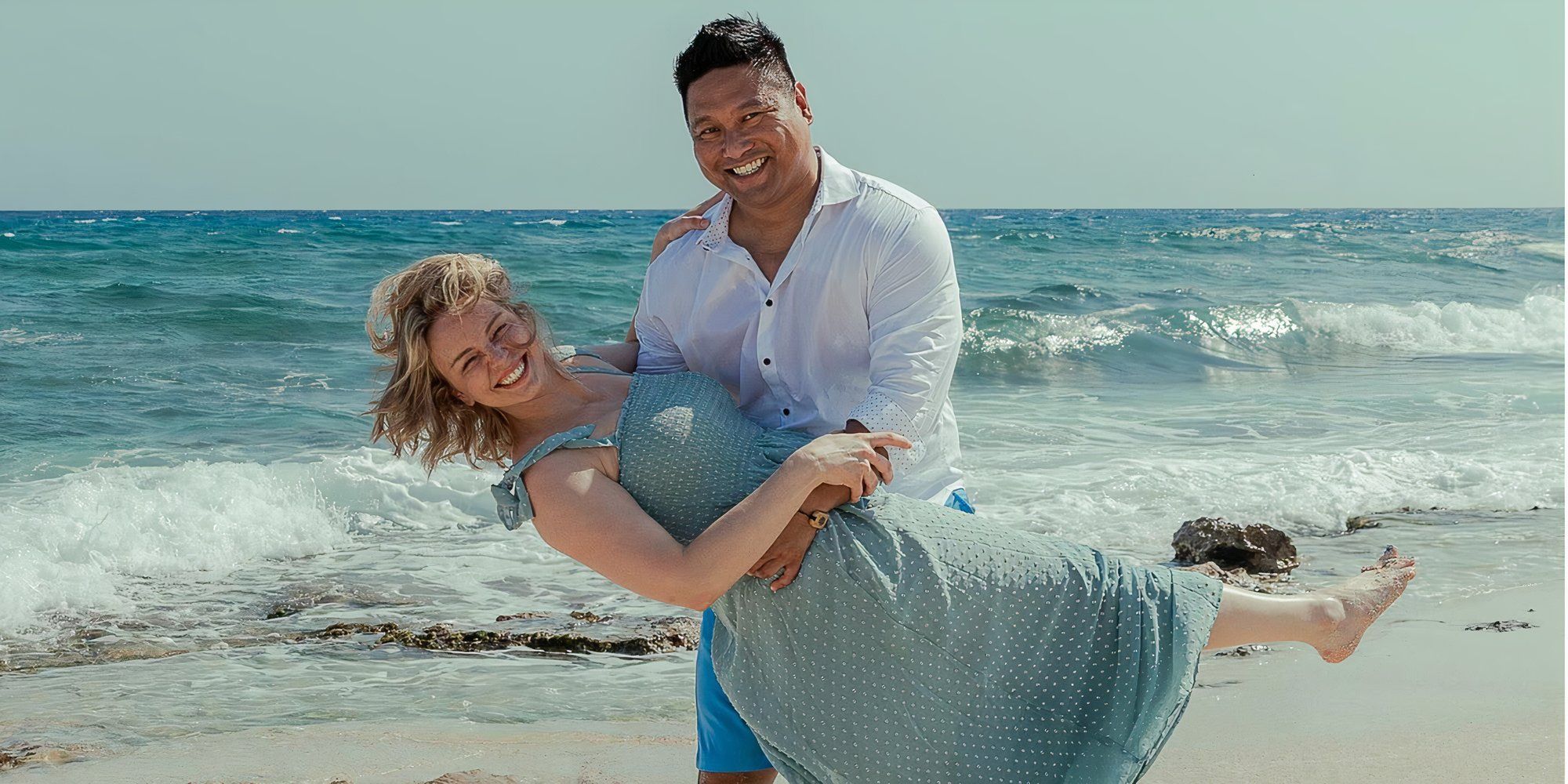 Married At First Sight's Lindsey Georgoulis and fiancé Ray posing together at the beach