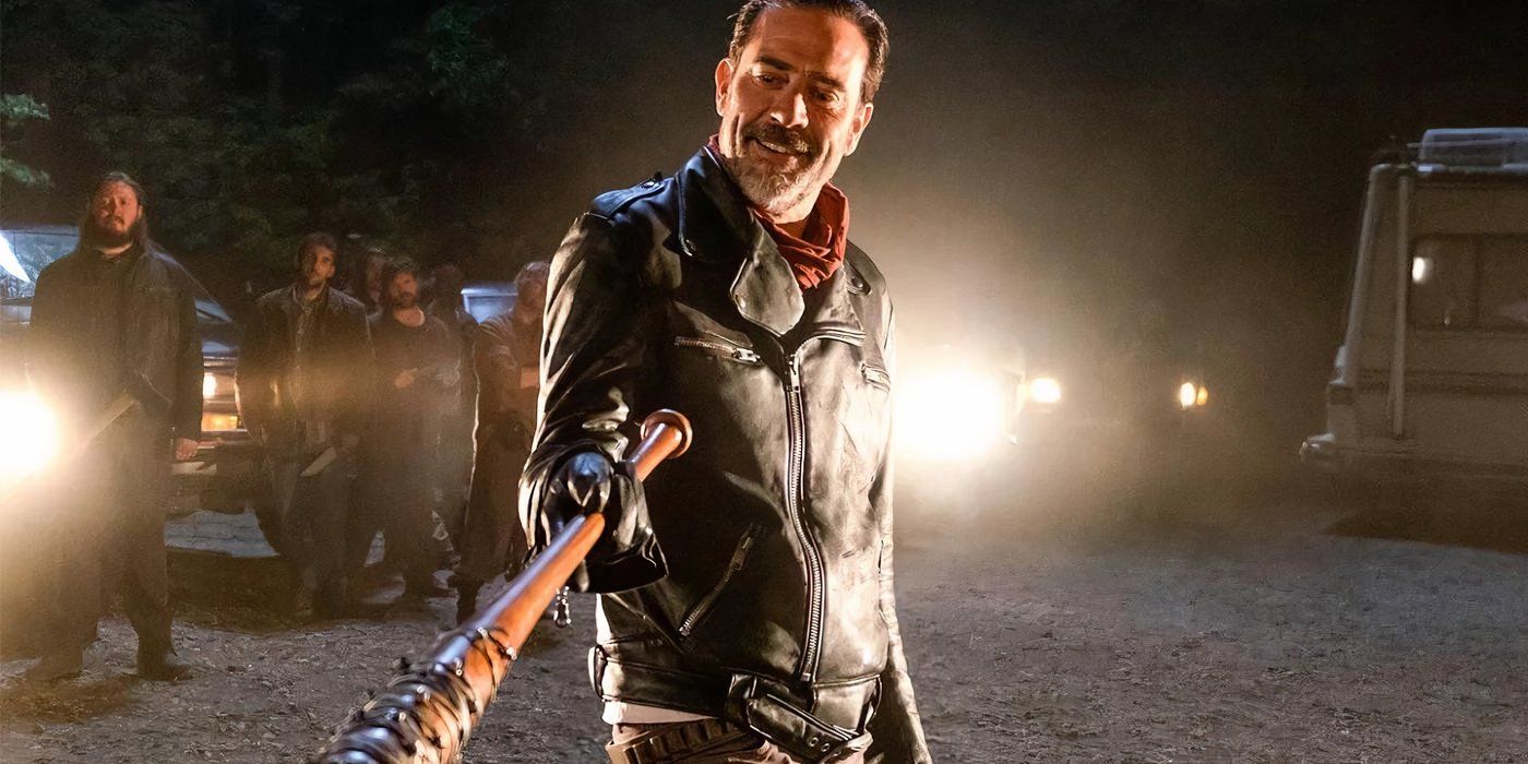 Jeffrey Dean Morgan smiling as Negan while pointing Lucille at someone in The Walking Dead