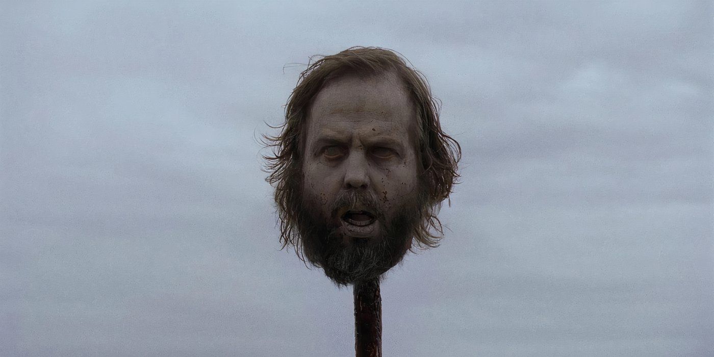 Ozzy's head on a pike after he's killed in the World's Fair episode of The Walking Dead