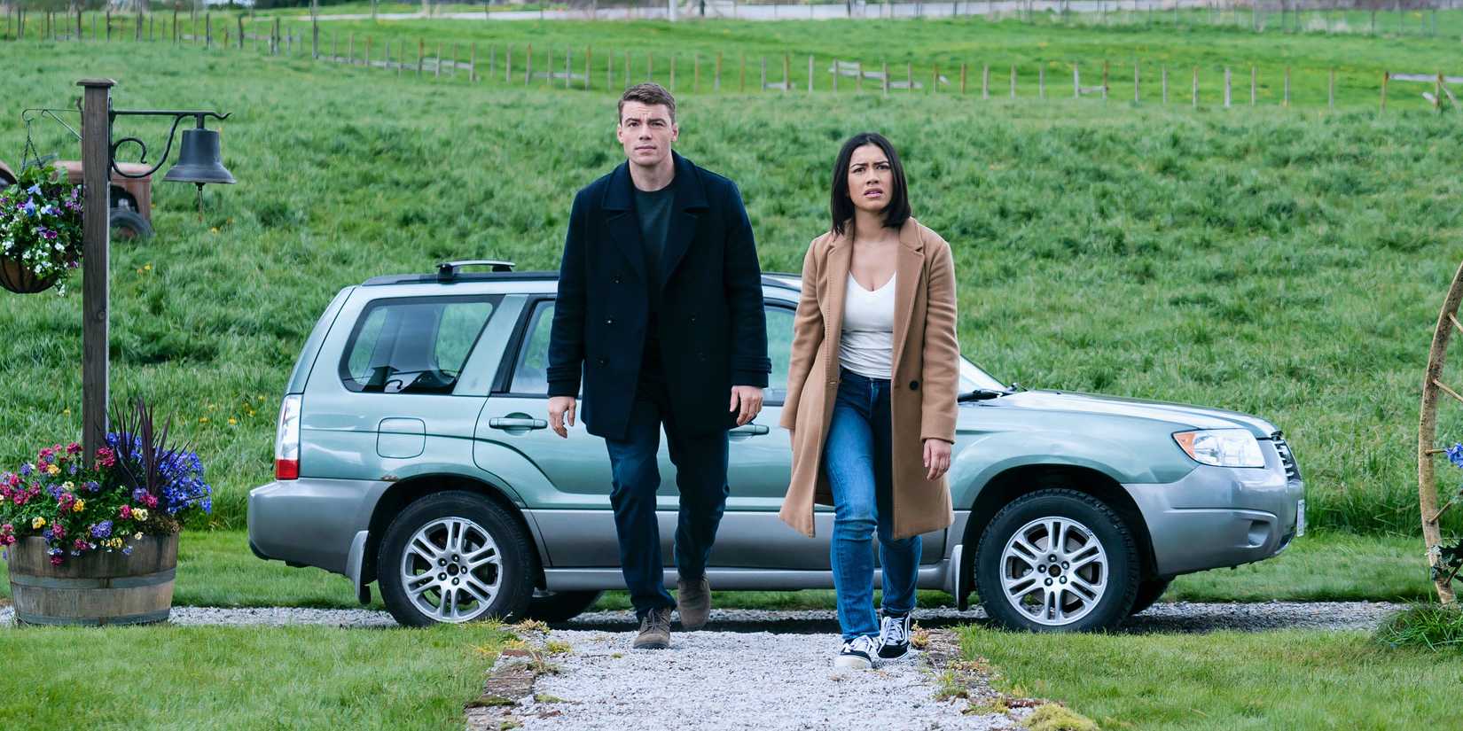 Peter and Rose walking away from their silver car in The Night Agent