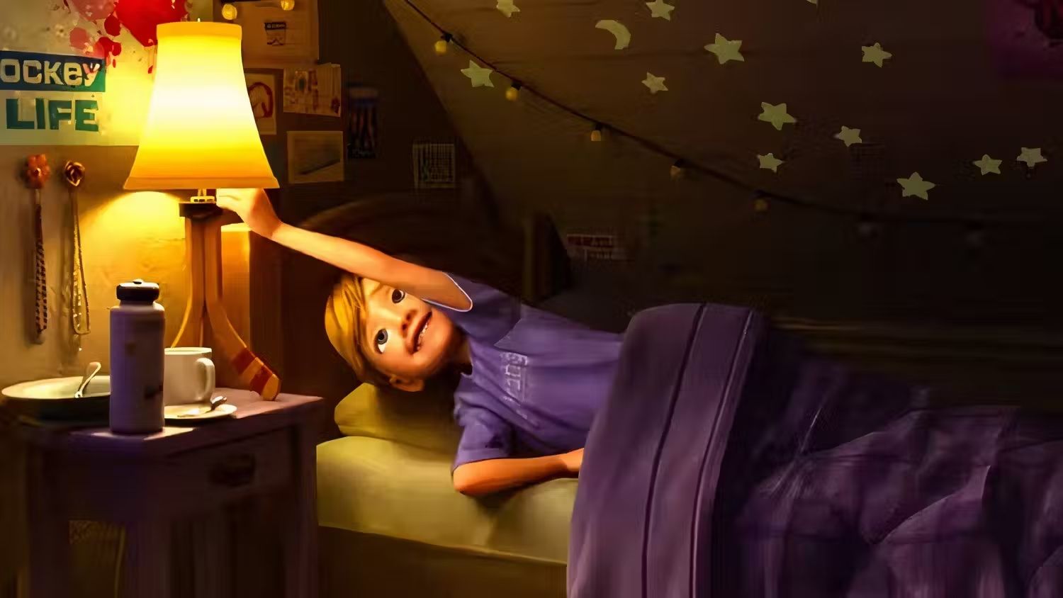 Riley in bed with 4*Town poster above her in Inside Out 2