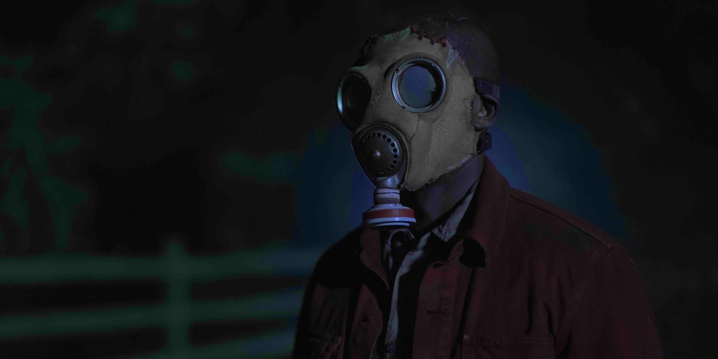 Rob Morgan wearing a gas mask in Teacup