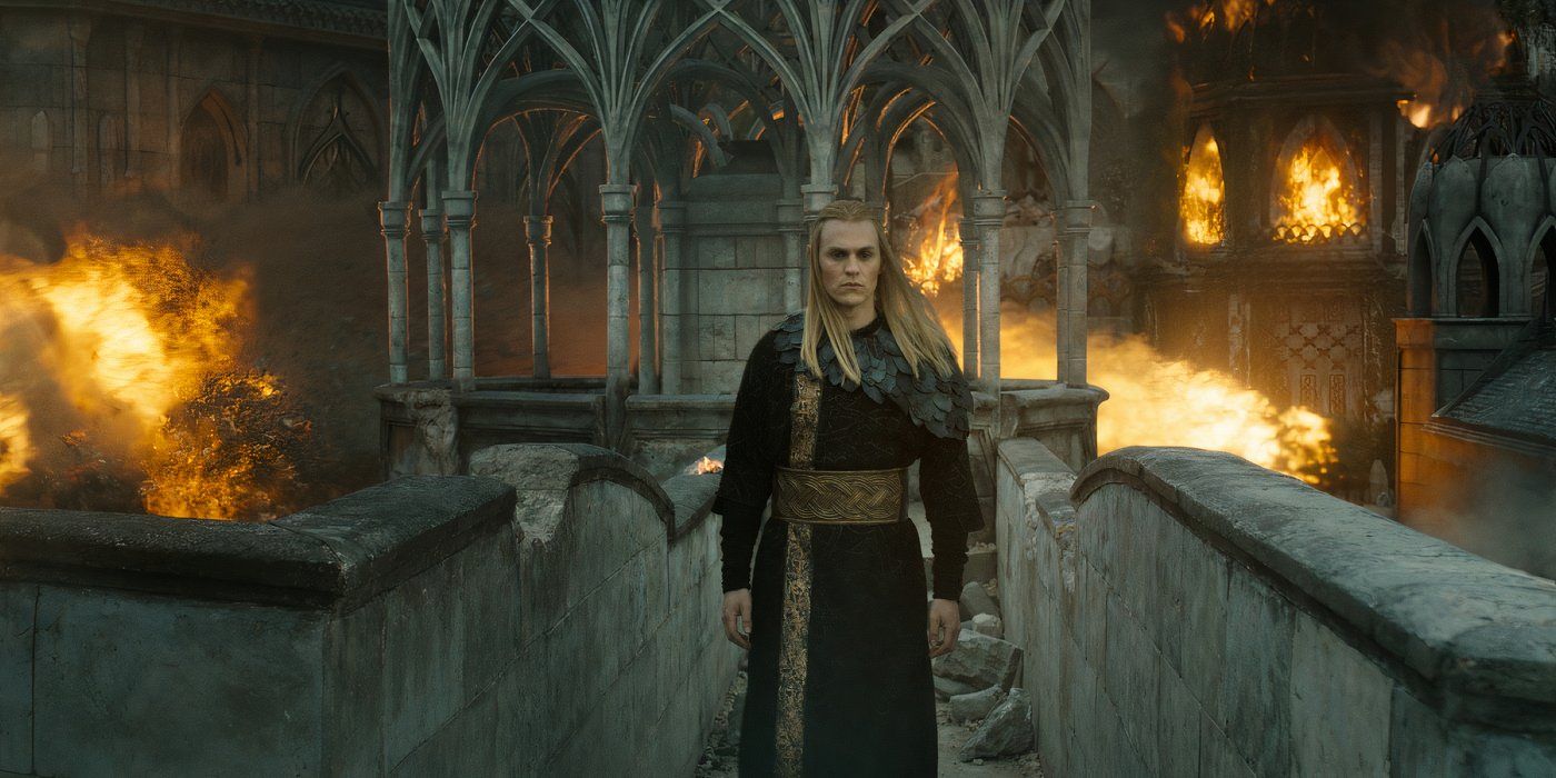 Sauron as Annatar walking across a bridge in Eregion as fire rages around him in Rings of Power season 2