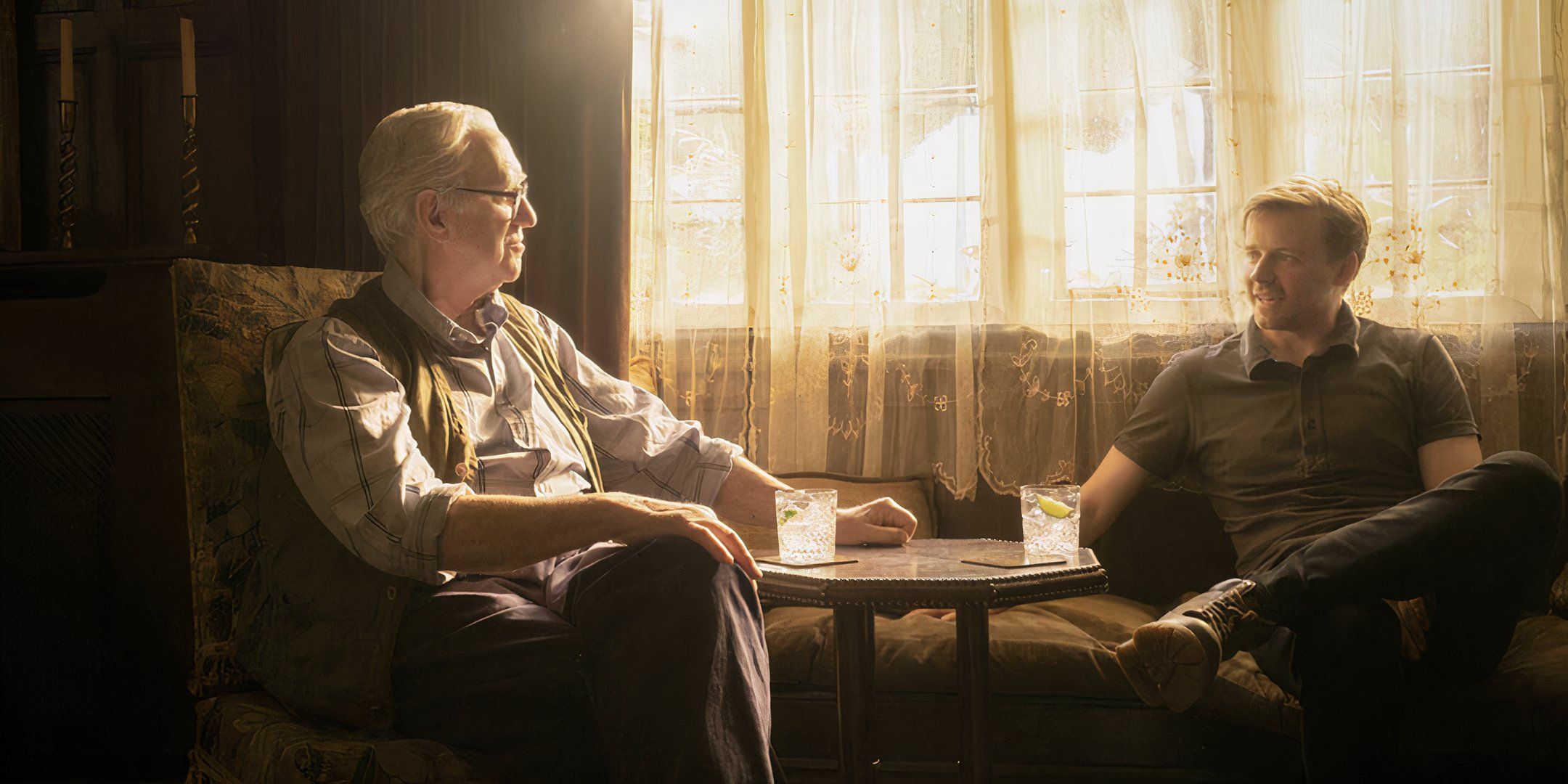 David Cartwright (Jonathan Pryce) sits with his grandson River (Jack Lowden) in the sunroom at Slow Horses.