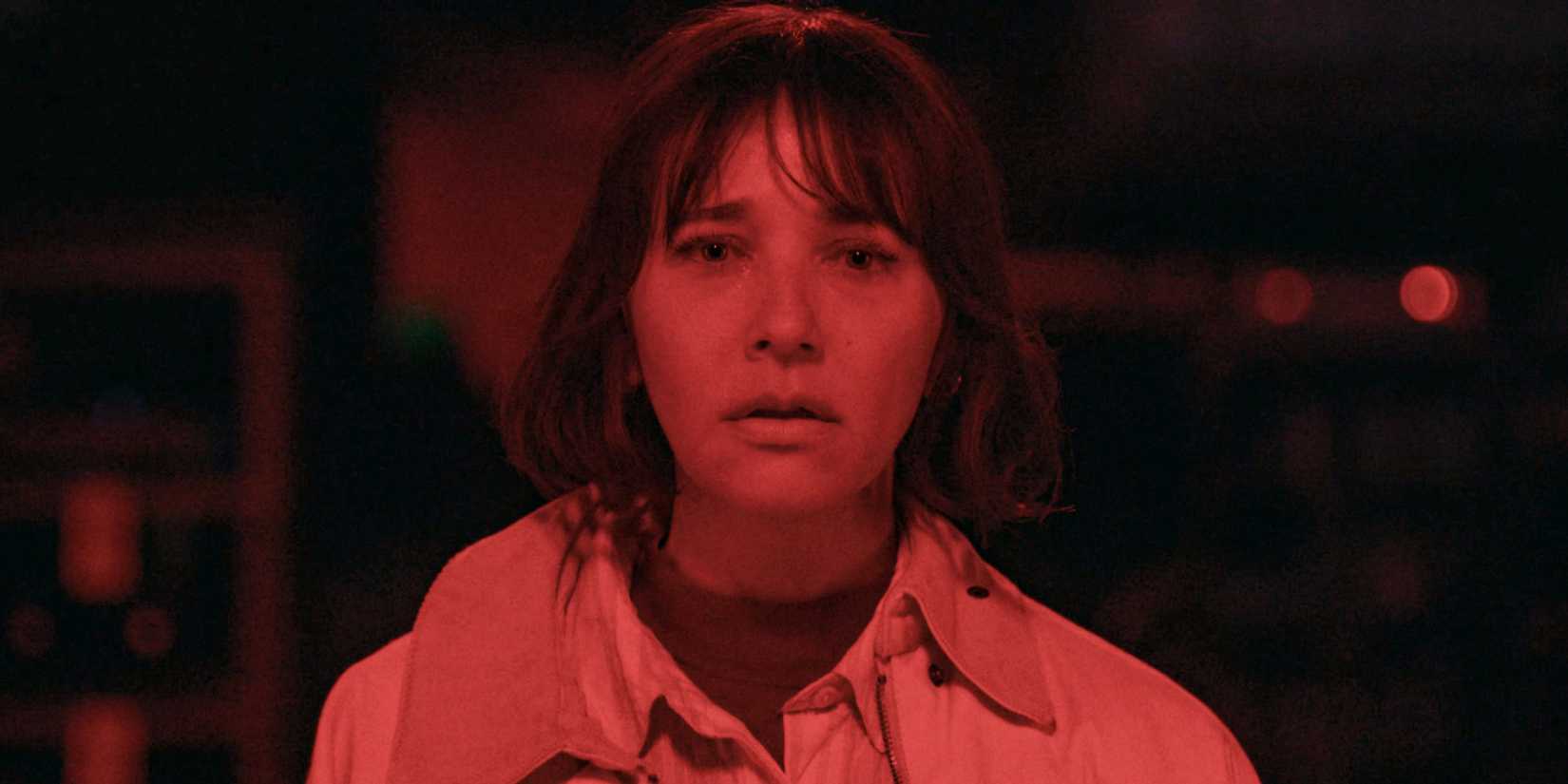 Suzie (Rashida Jones) illuminated in red light in Sunny Season 1 Episode 8