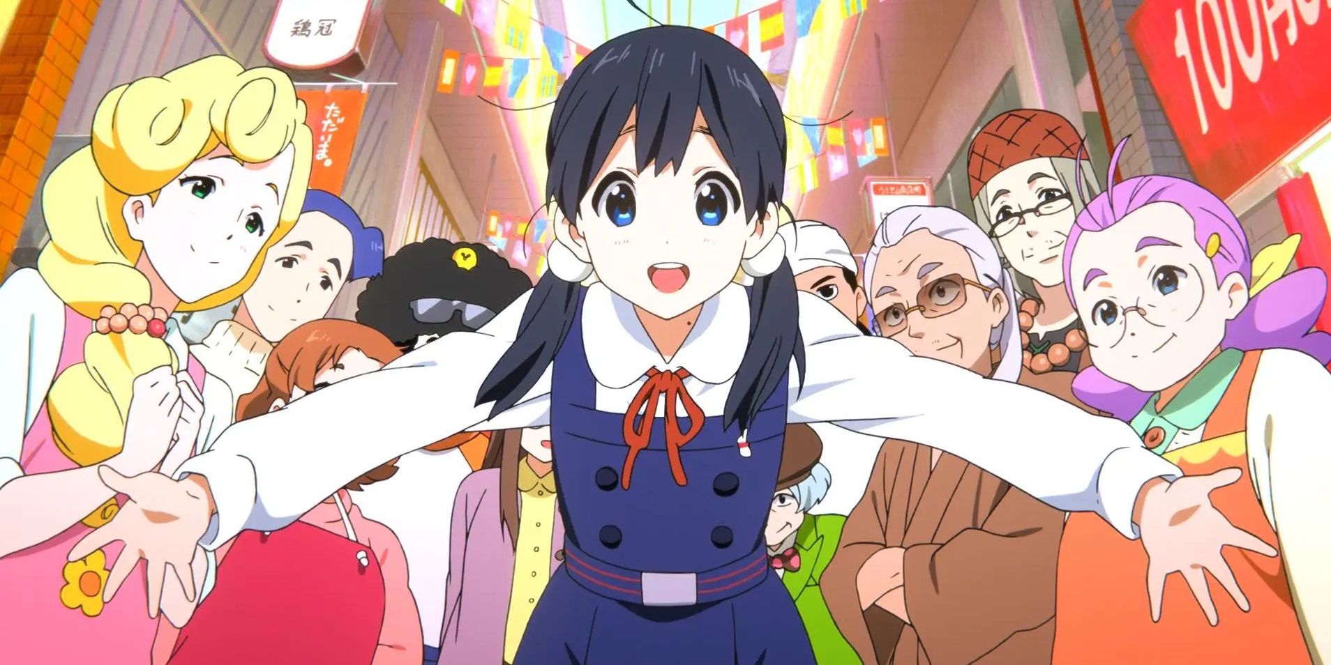 Tamako em frente aos lojistas do distrito comercial Tamako Market