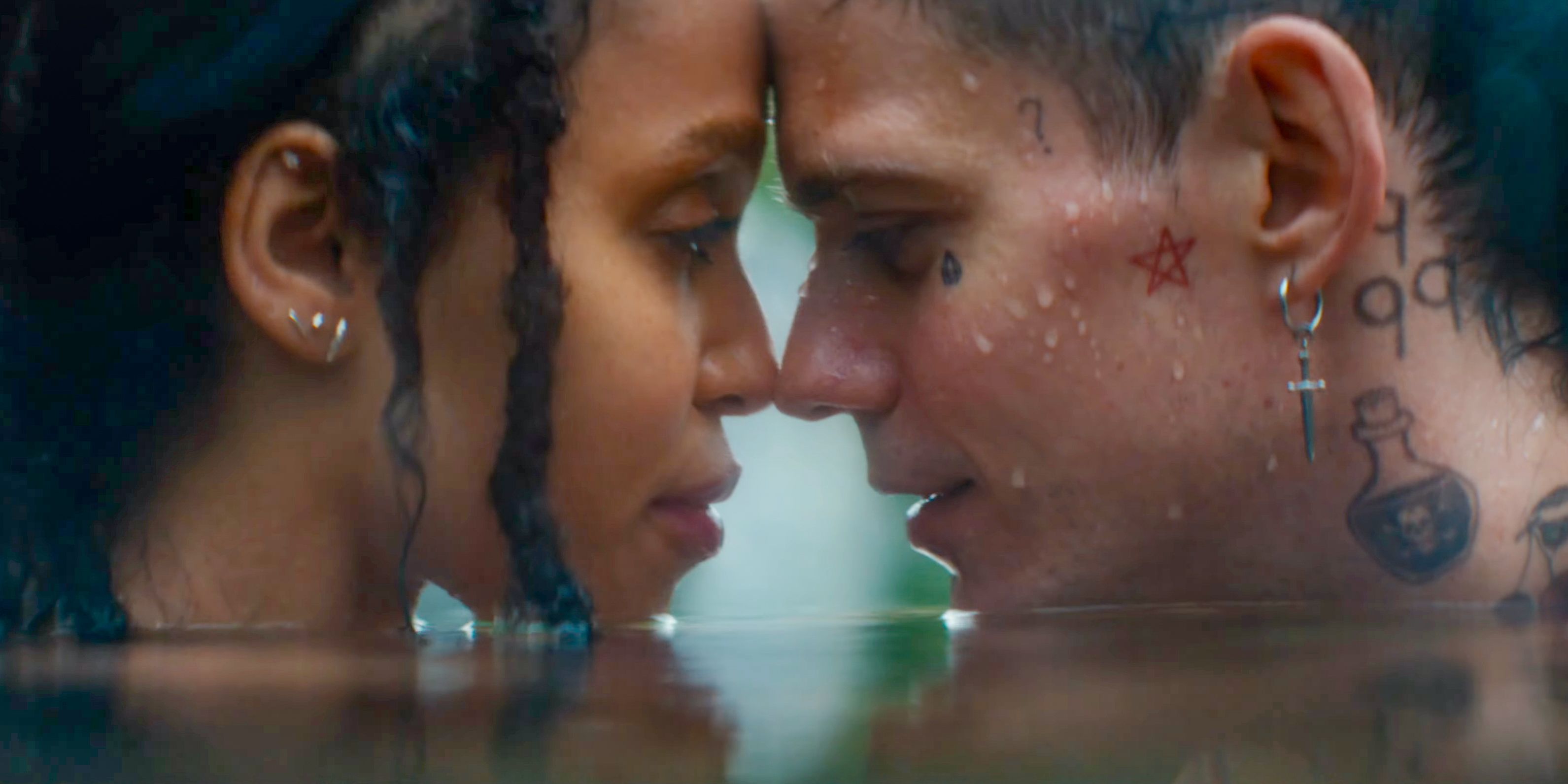 Shelly (FKA twigs) and Eric (Bill Skarsgård) touch their foreheads in The Crow (2024) 