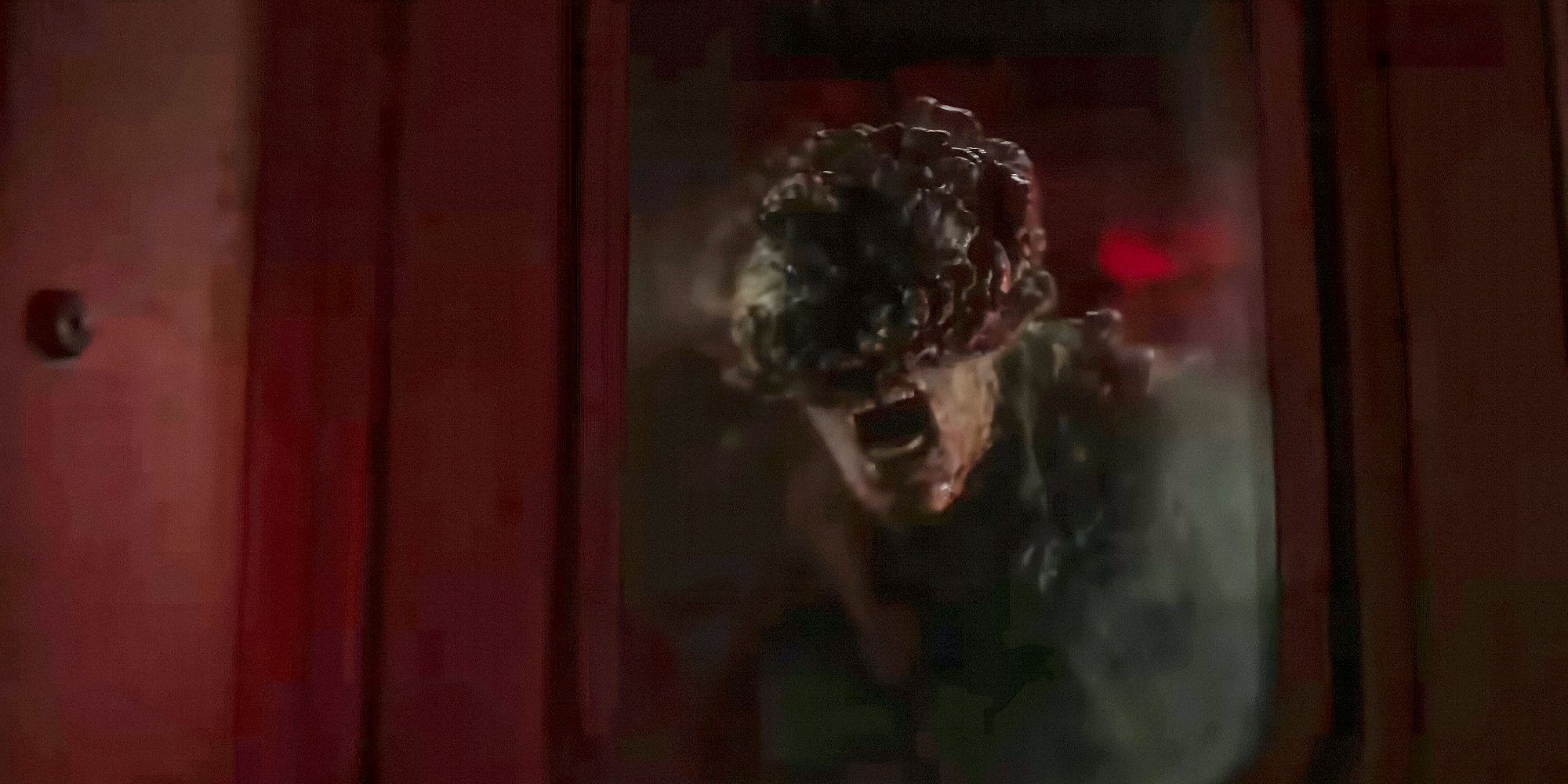 A Clicker on the other side of a window in The Last of Us Season 2 