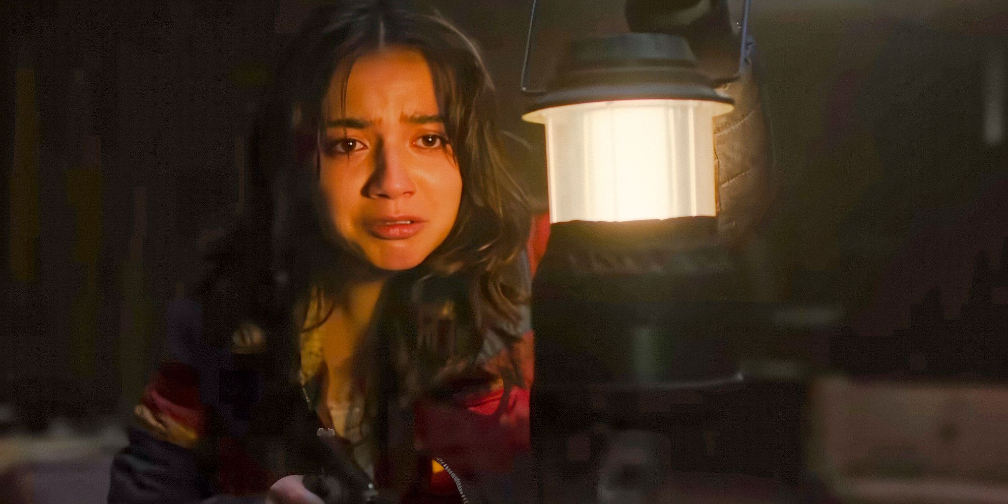 Dina (Isabela Merced) holds a flashlight in season 2 of The Last of Us.