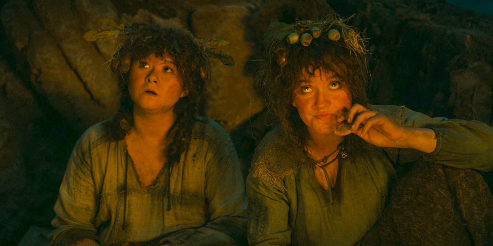 Poppy (Megan Richards) and Nori (Markella Kavenagh) beside a campfire in The Lord of the Rings: The Rings of Power Season 2 Episode 1