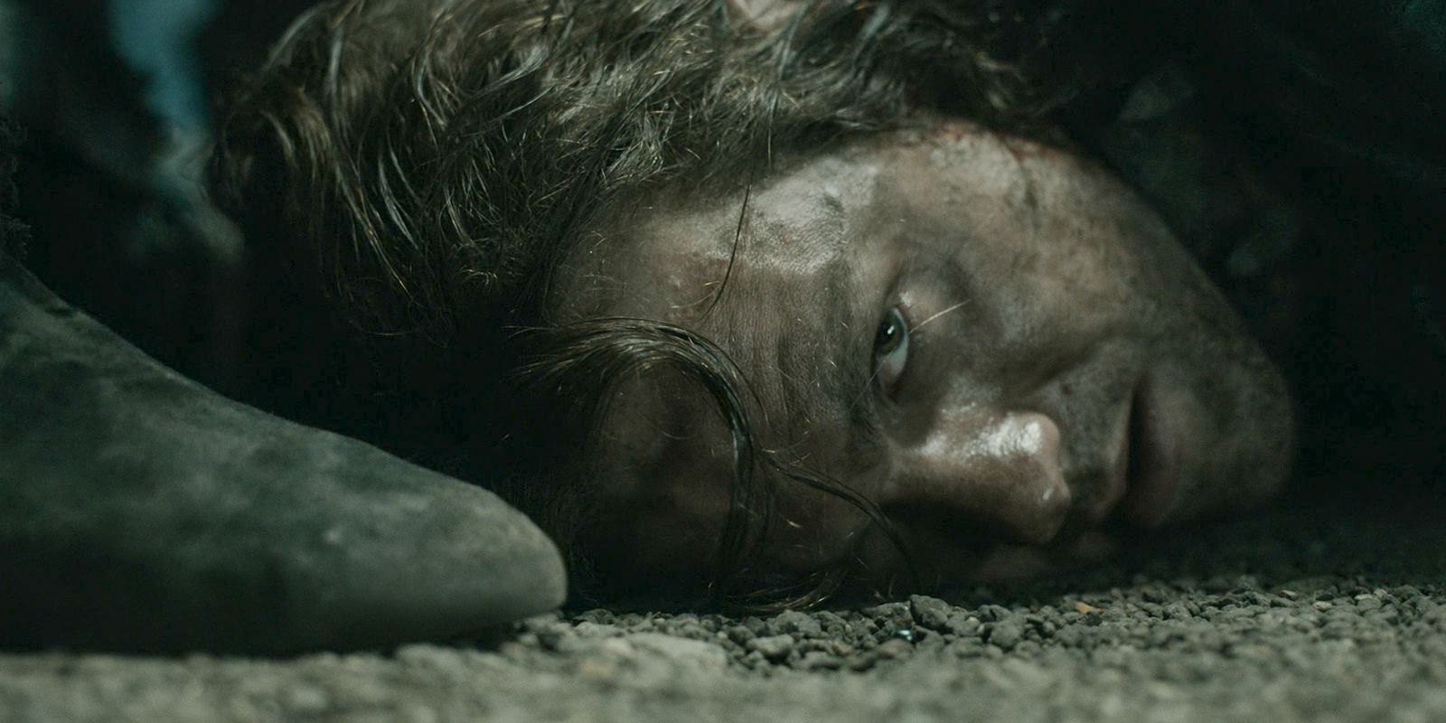 Sauron (Charlie Vickers) with his head at Adar's feet, swearing allegiance in The Lord of the Rings: The Rings of Power Season 2 Episode 1