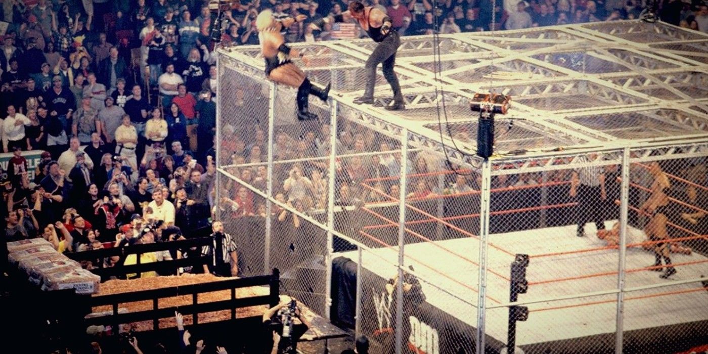 The Undertaker shoves Rikishi off of the Hell in a Cell while The Rock is in the ring at WWE Armaggedon 2000