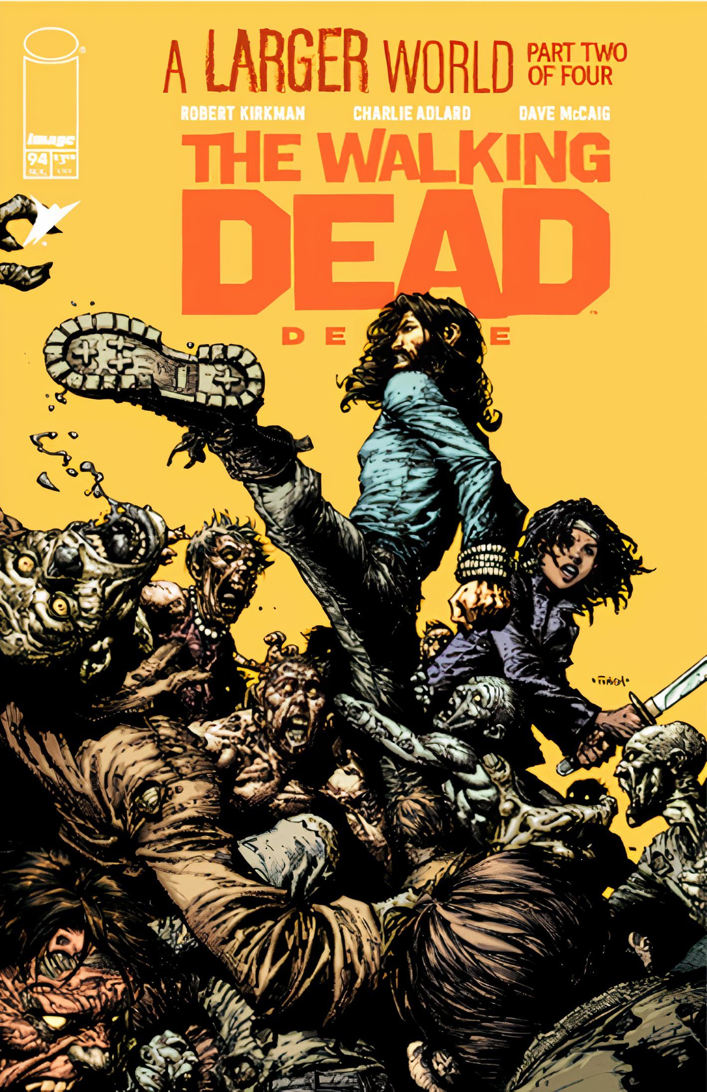 Capa de The Walking Dead Deluxe #94, Jesus dá um super chute em um zumbi enquanto Michonne balança sua katana