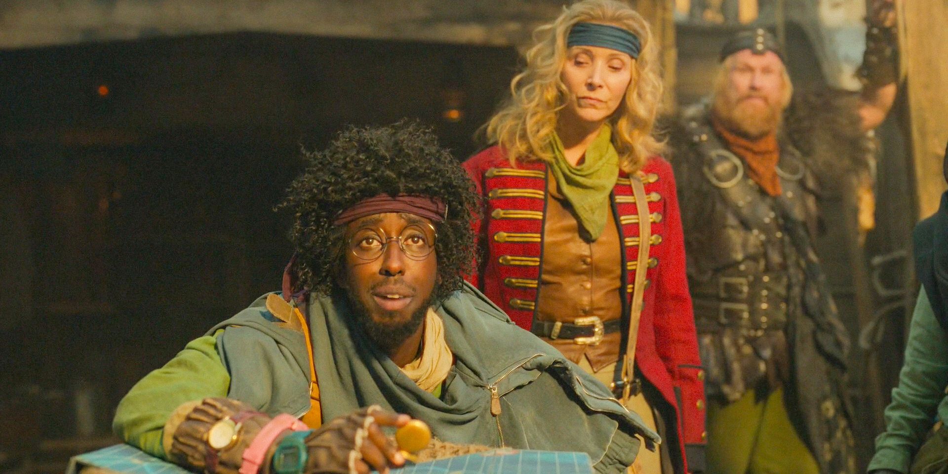 Widgit (Roger Jean Nsengiyumva) examining the map while Penelope observes with curiosity in Time Bandits Season 1