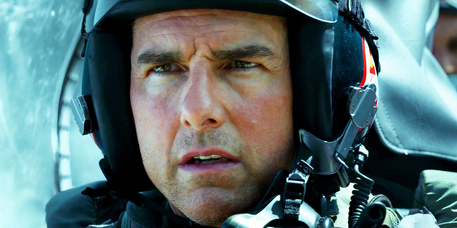 Tom Cruise looking concerned in Top Gun Maverick