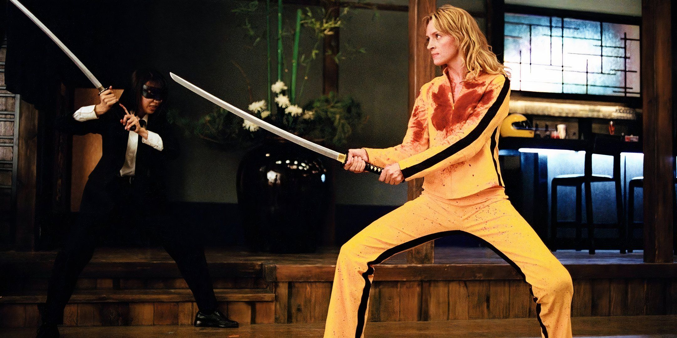 uma thurman wears a bloodied yellow tracksuit in the crazy 88 fight in kill bill: vol.1