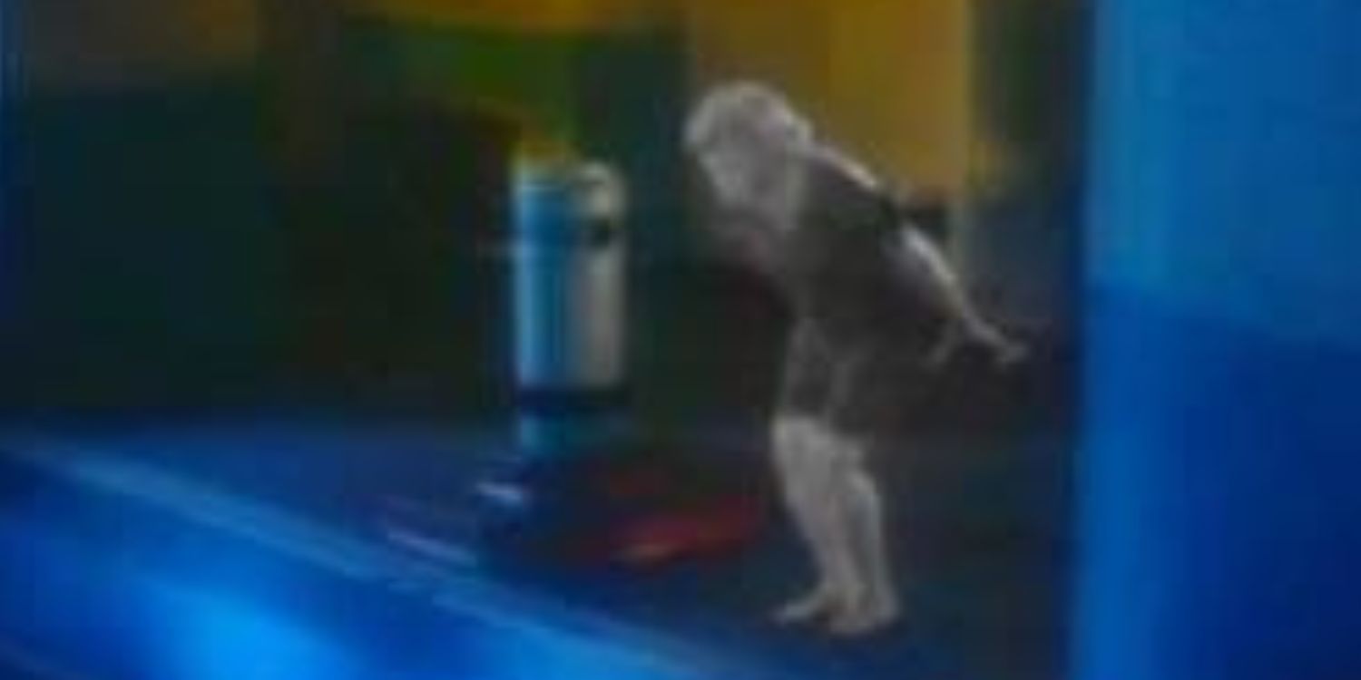 A still from Unsolved Mysteries. A monochrome elderly woman crouches as if about to dive into a pool.