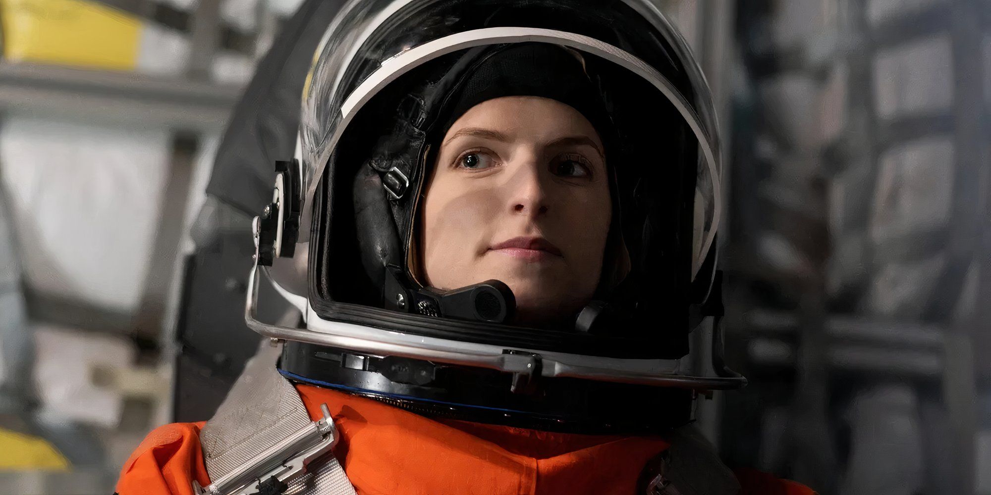 Anna Kendrick as Zoe Levenson wearing an orange spacesuit in Stowaway.