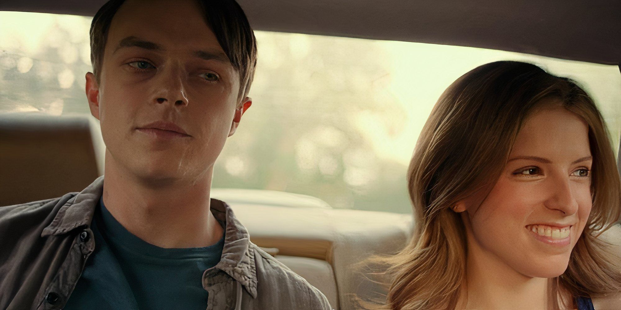 Anna Kendrick as Erica and Dane DeHaan as Zach sat in a car smiling in Life After Beth.