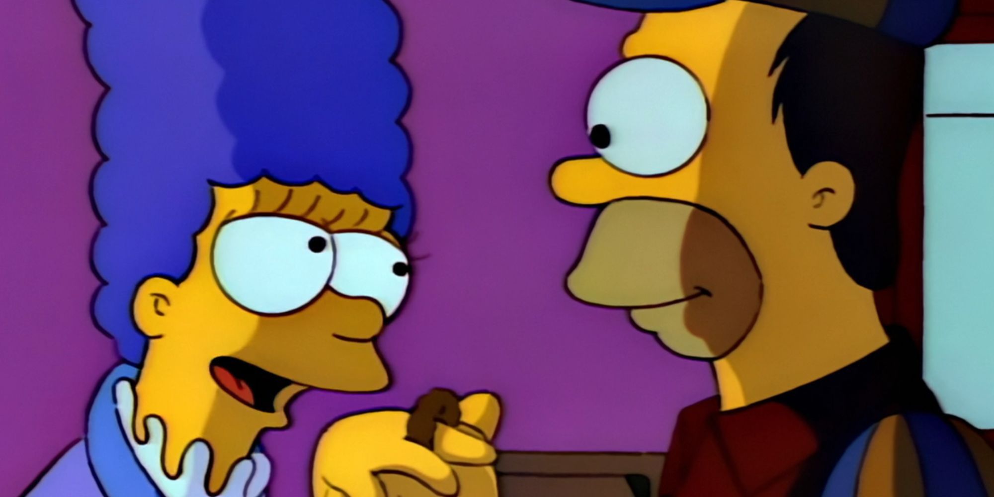 Marge wears an onion ring on her finger while Homer smiles at her in The Simpsons