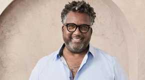 The golden bachelorette's Gary smiling happily in nice clothes