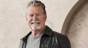 the golden bachelorette's jack grinning in a nice outfit