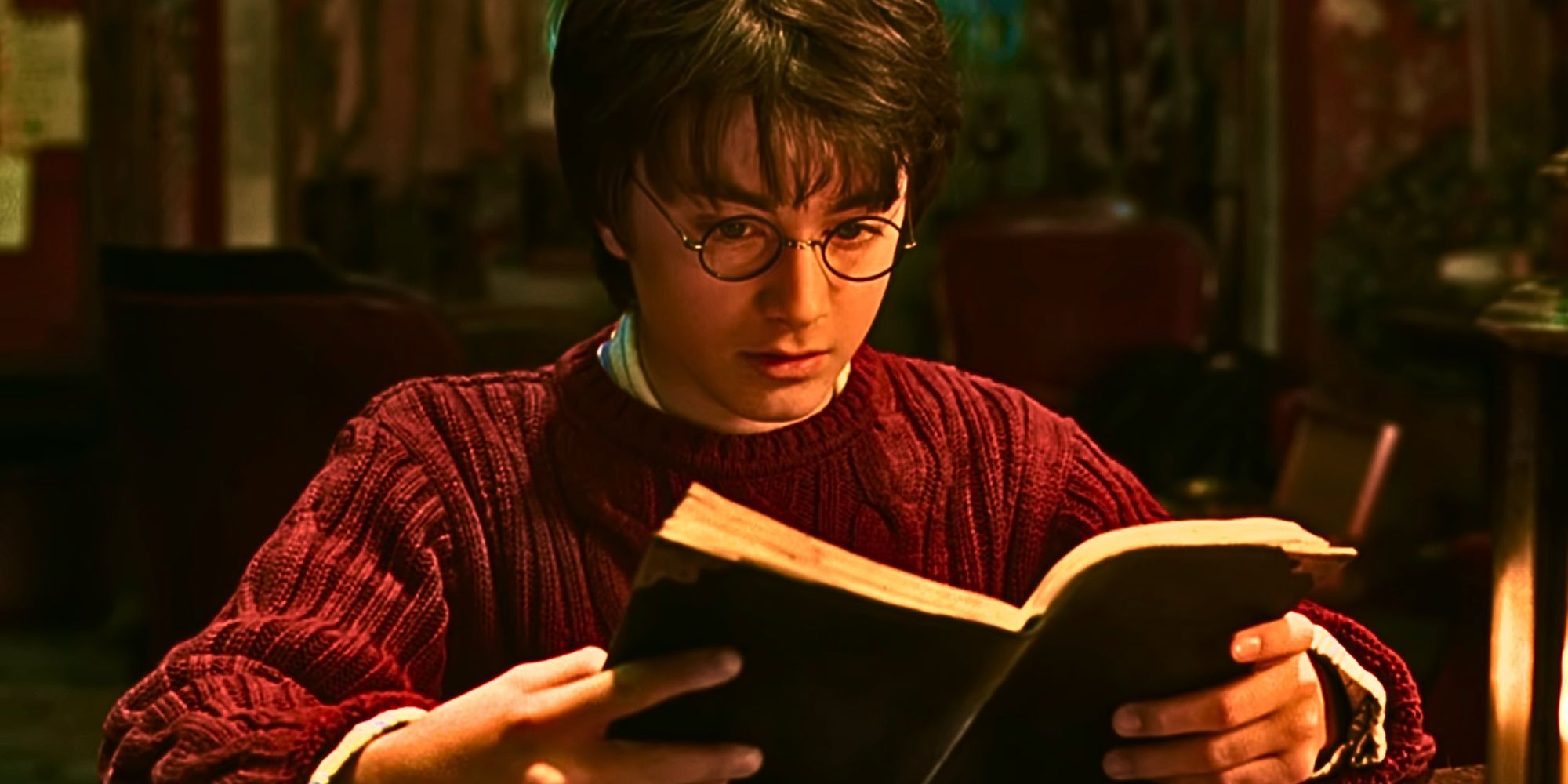 Daniel Radcliffe as Harry Potter reads Tom Riddle's diary in The Chamber of Secrets