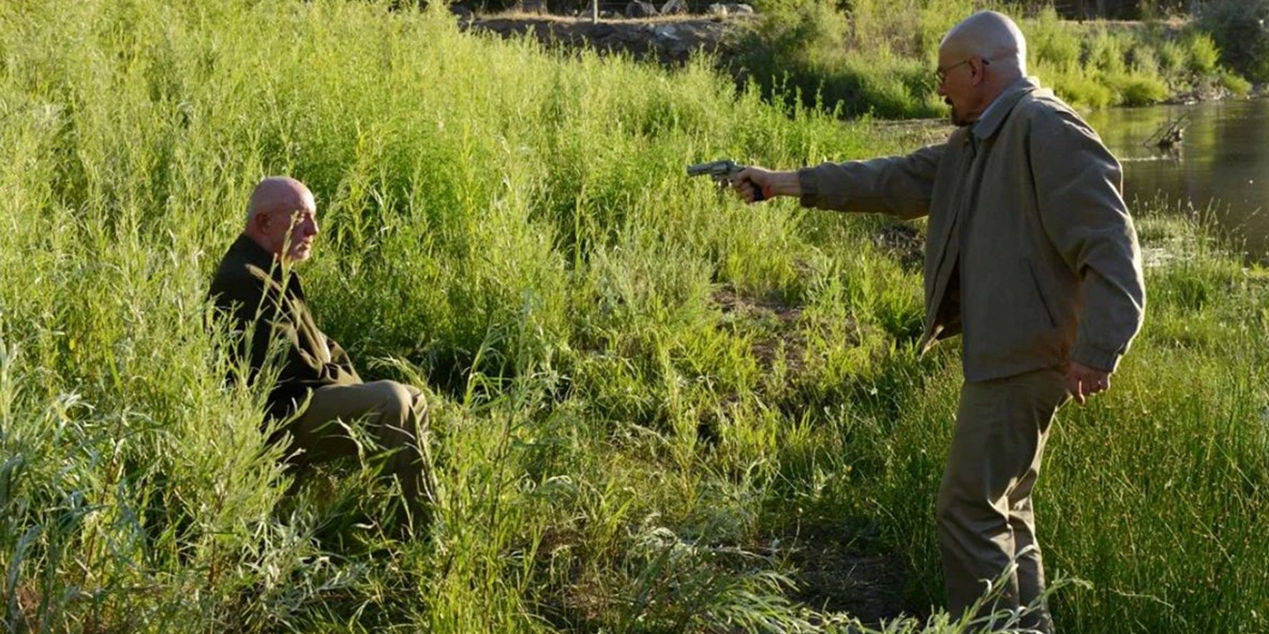 Walt points a gun at Mike in Breaking Bad