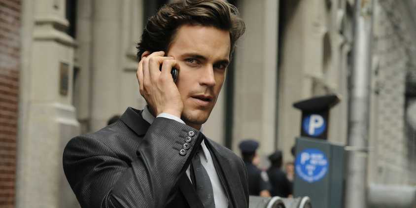 Neal Caffrey (Matt Bomer) talks on the phone in White Collar