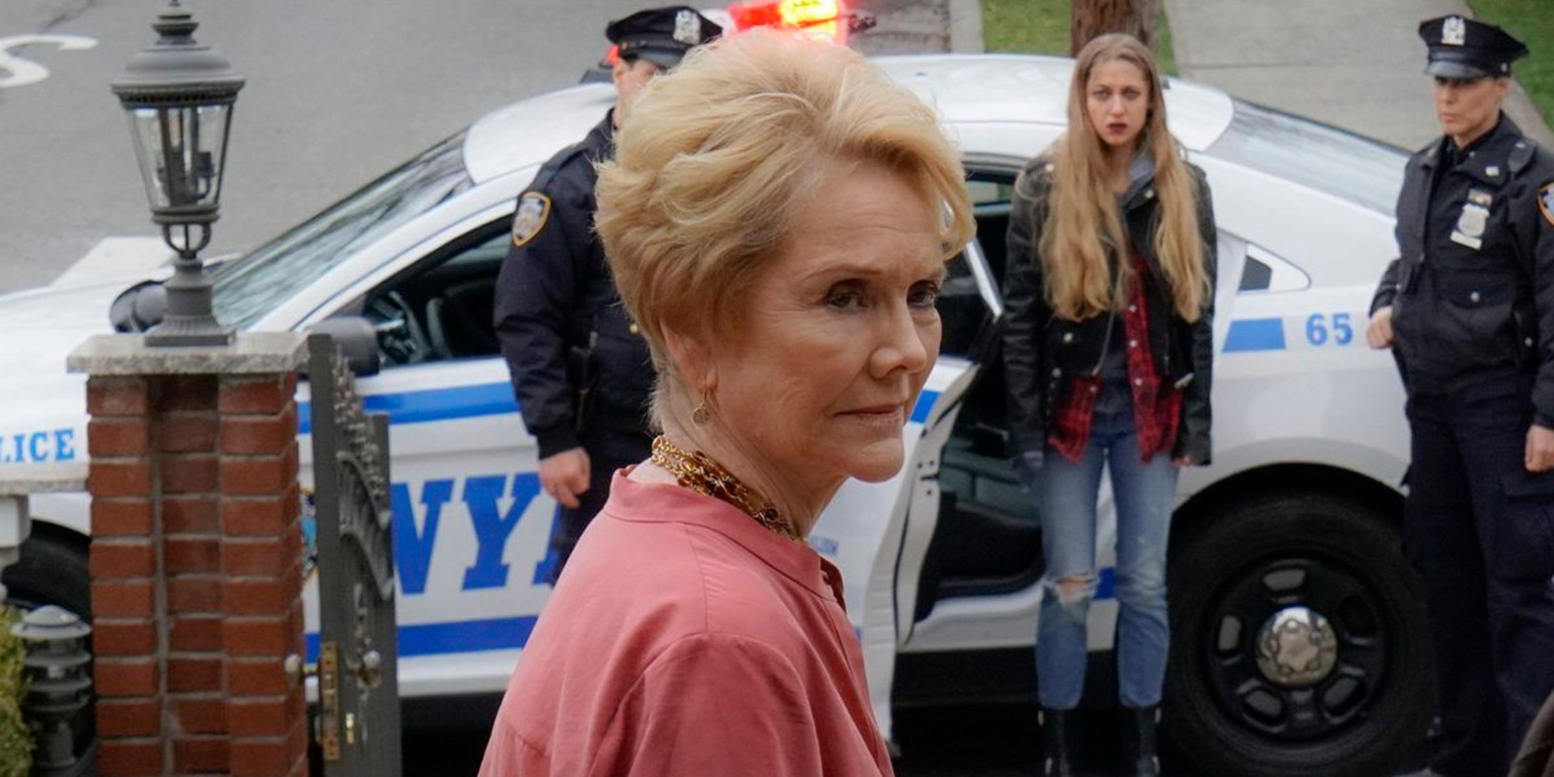 Blue Bloods Donna standing in front of her house as her granddaughter is arrested