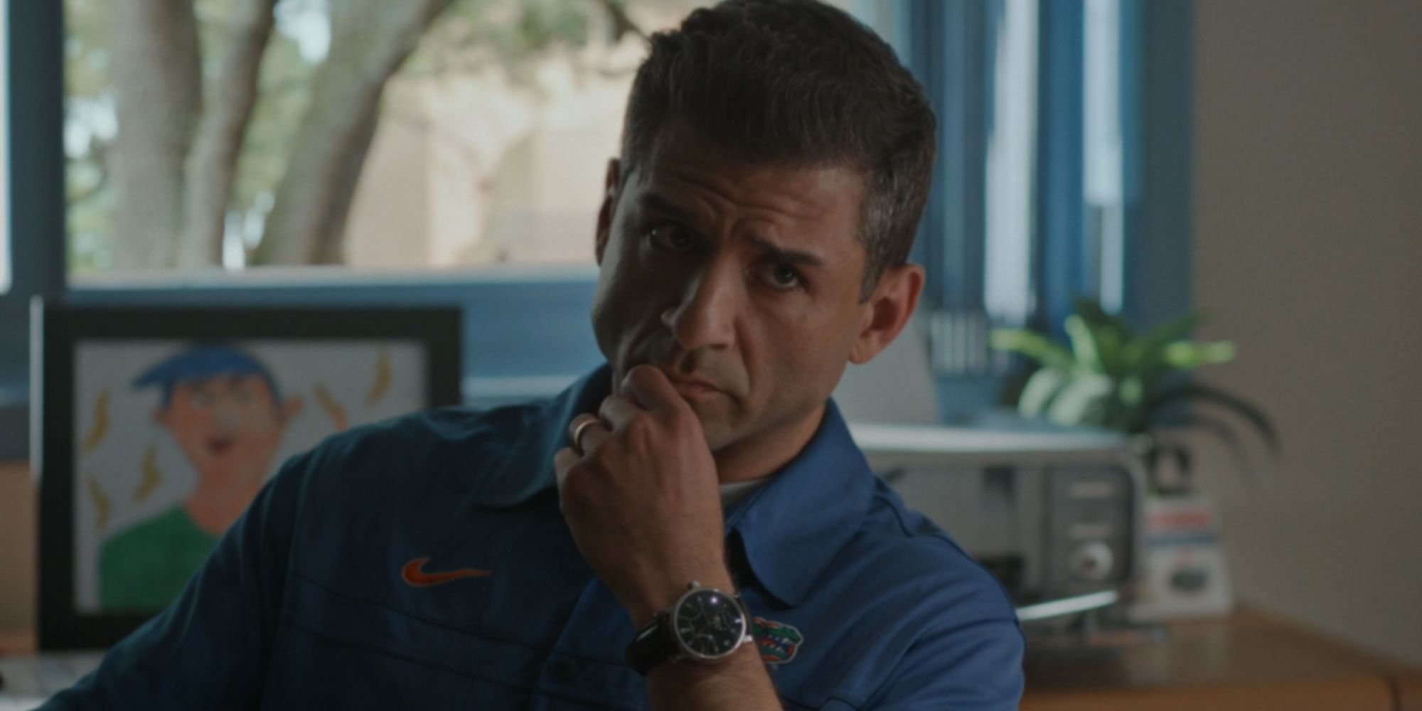 Tony Yazbeck as Urban Meyer looking thoughtful in American Sports Story