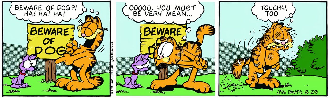 Garfield getting beat up by a small dog after he laughs at him.