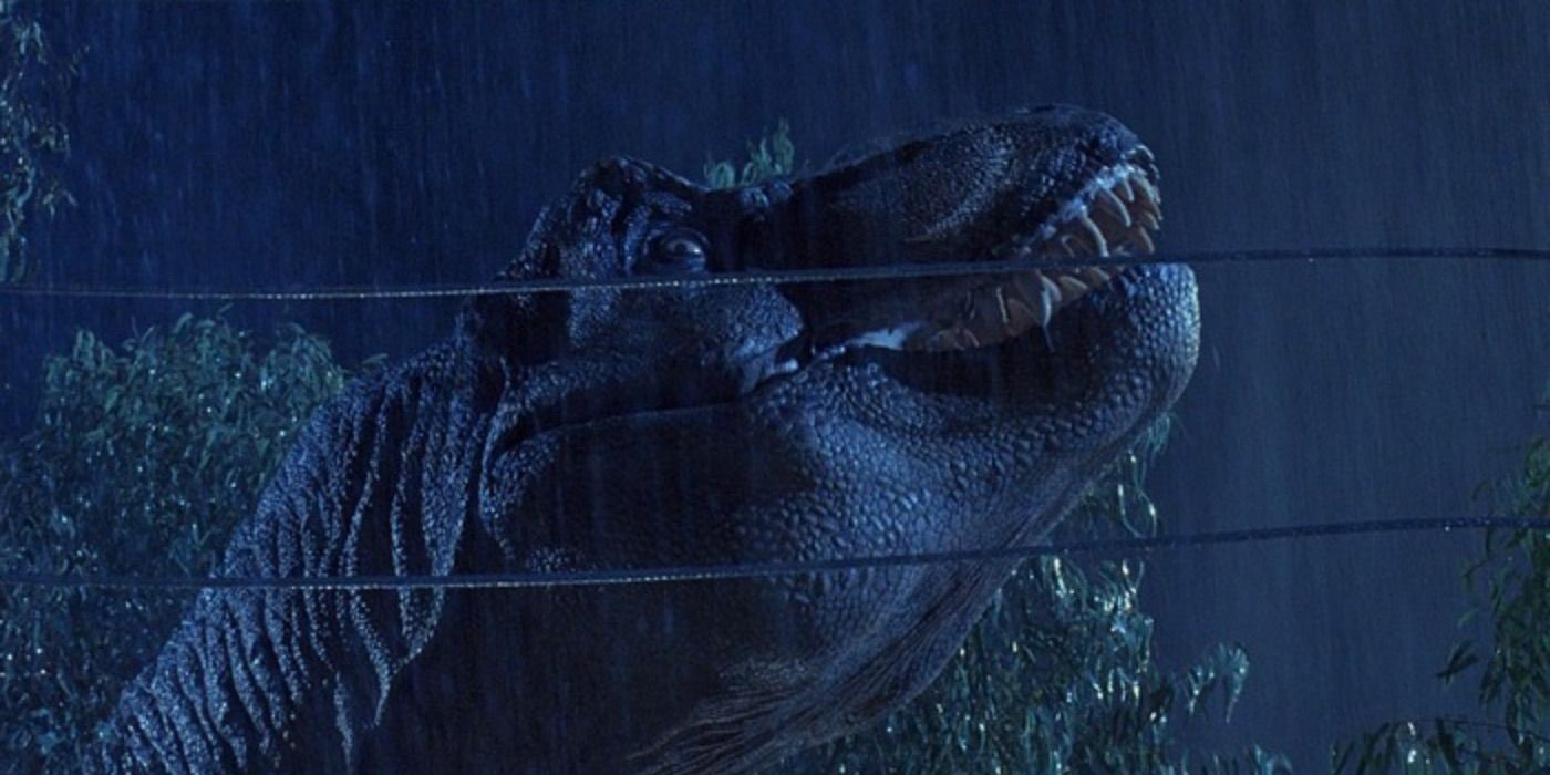 T Rex looks over the fence in Jurassic Park.