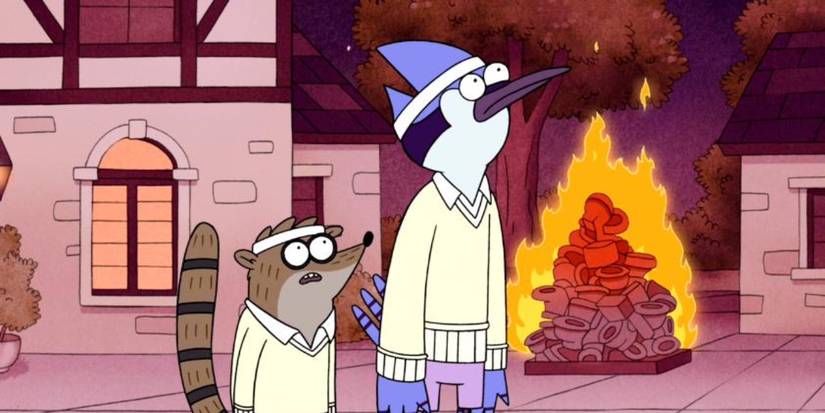 Mordecai and Rigsby in front of a burning pile of toilets in Regular Show