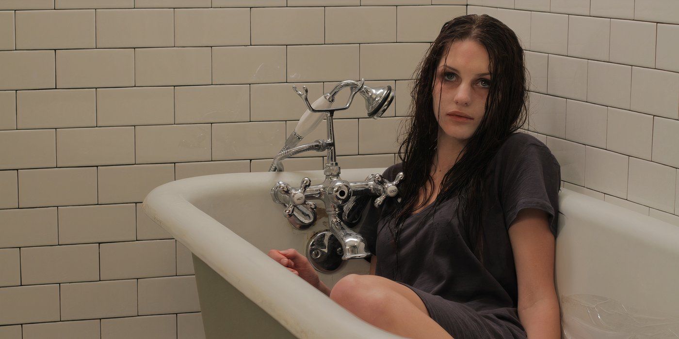 A creepy girl in a bathtub in the 2011 horror movie A Haunting in Salem