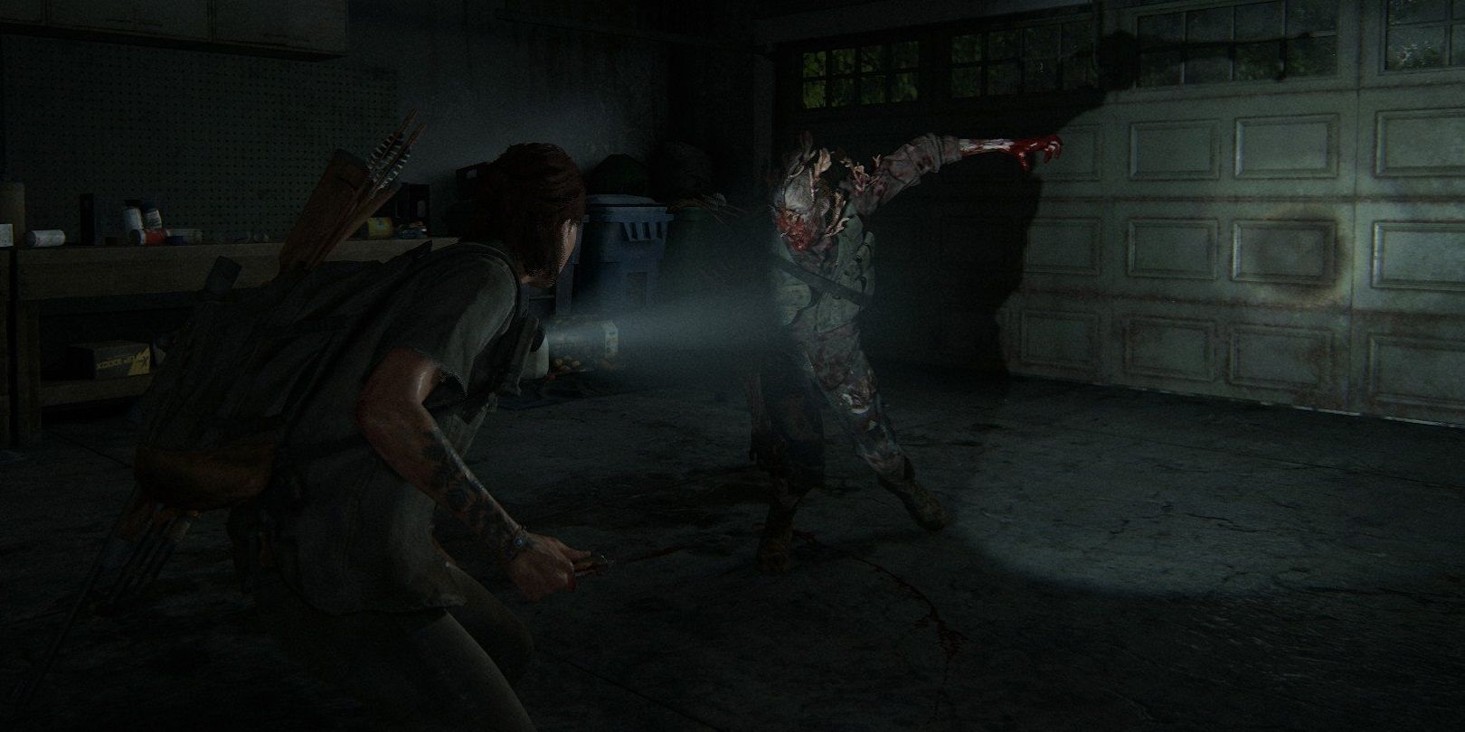 A stalker swings at Ellie in The Last of Us Part II