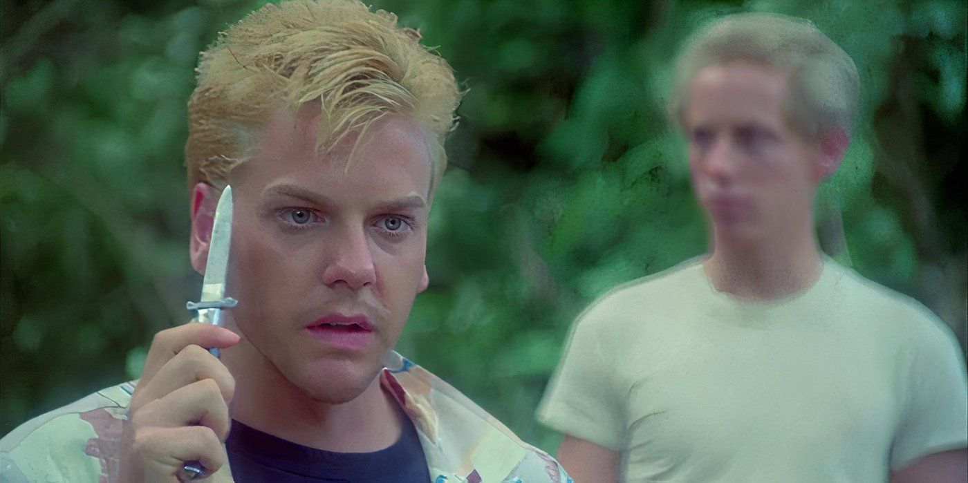 Kiefer Sutherland como Ace segurando uma faca em Stand by Me